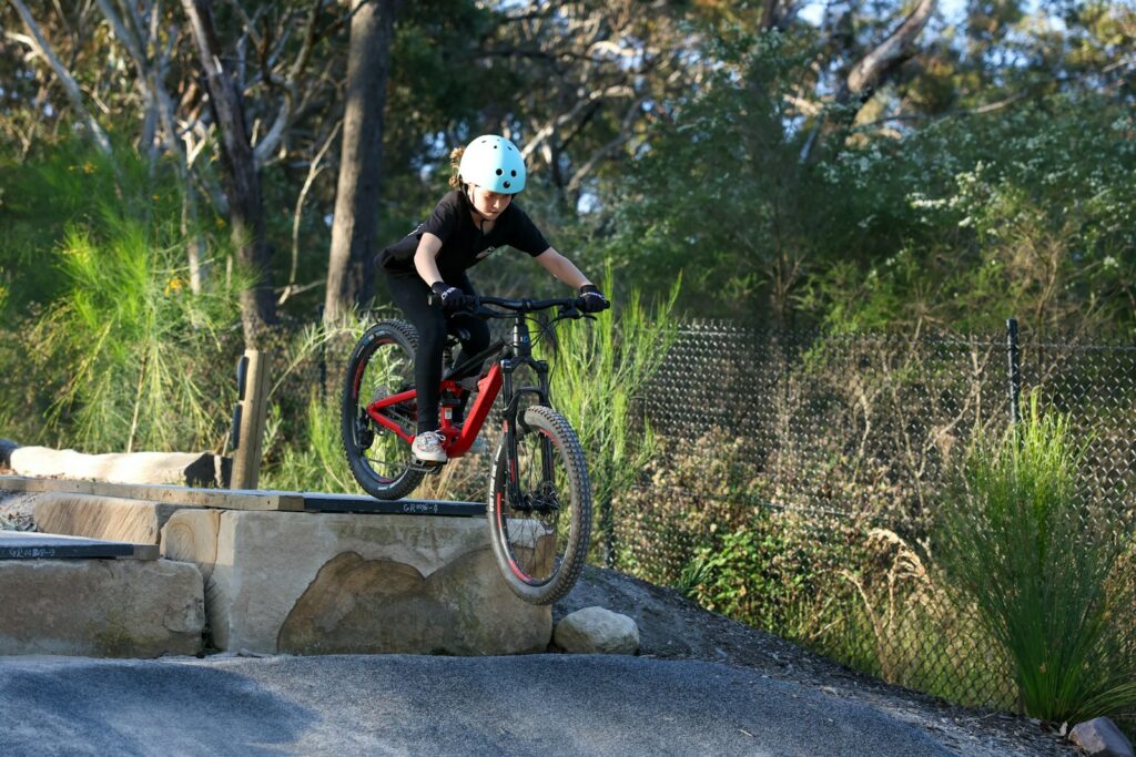 A man riding a bike on top of a ramp